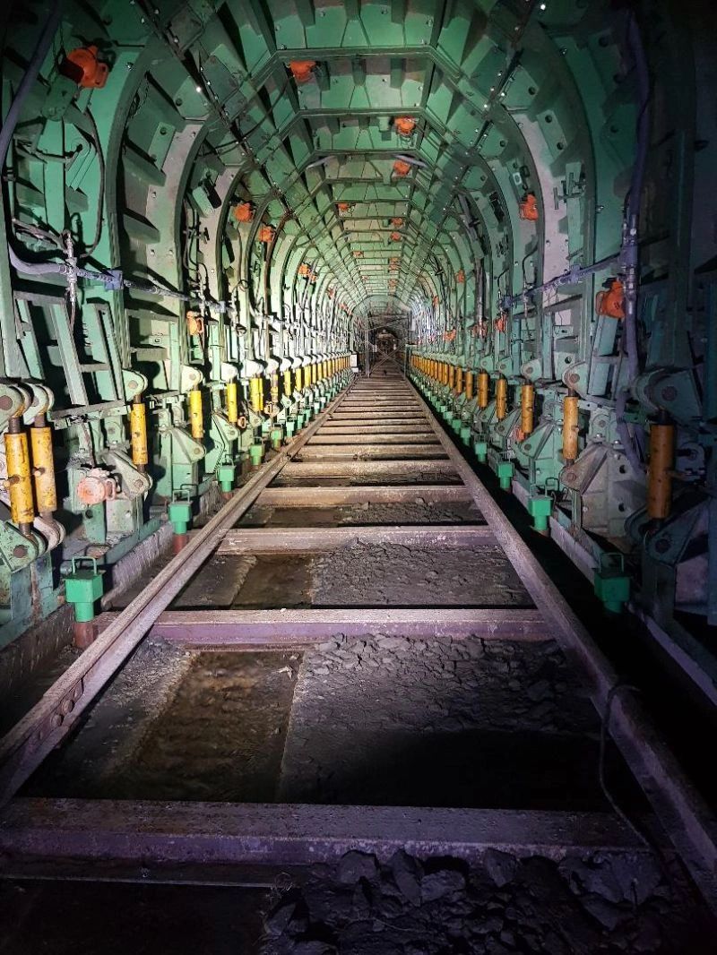 TBM backup conveyor and precast lining segments inside tunnel